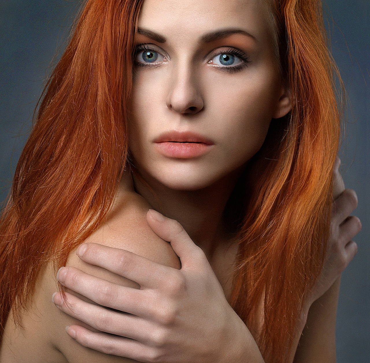 Portrait of a woman with long red hair