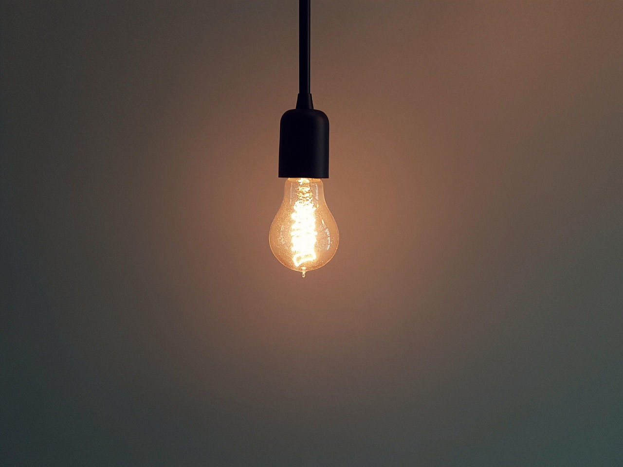 A warm, glowing incandescent bulb
